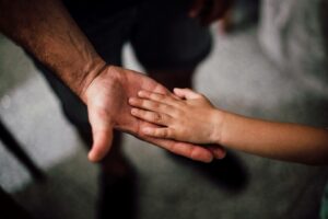 selective focus photography of child s hand stockpack pexels scaled
