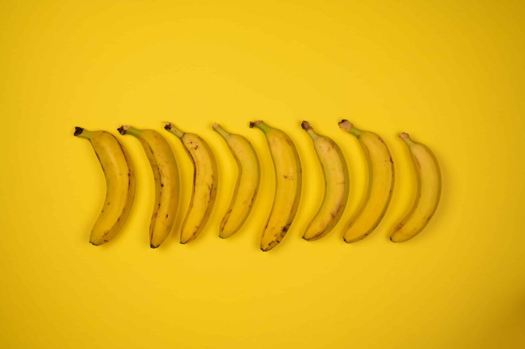 Backdrop of whole fresh bananas with stems