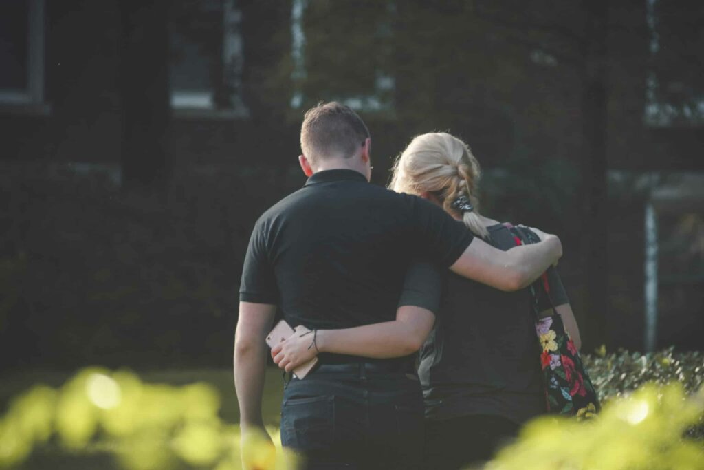 Couple walking toward building