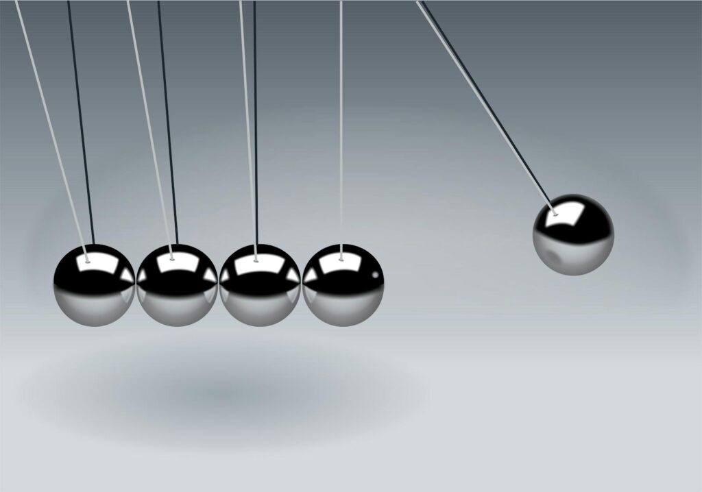 Dynamic illustration of Newton's Cradle showing motion and reflection concepts in physics.